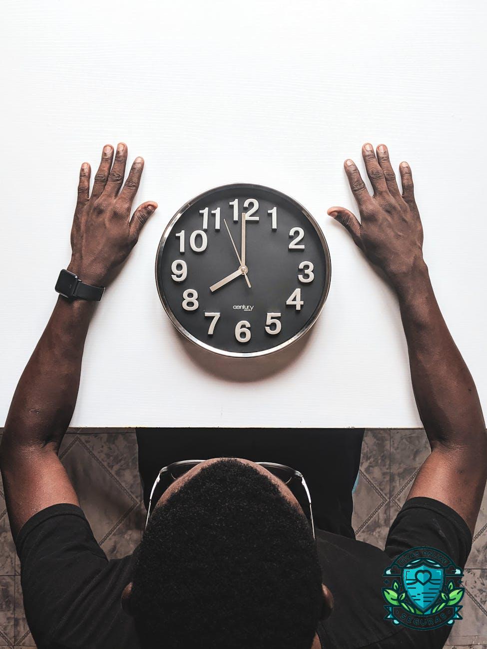 round silver colored wall clock