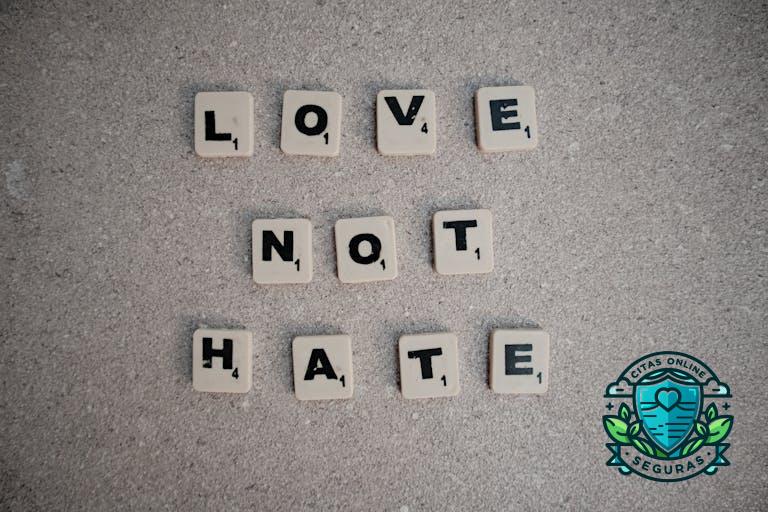 Scrabble tiles on pavement spelling the inspirational message 'Love Not Hate'.