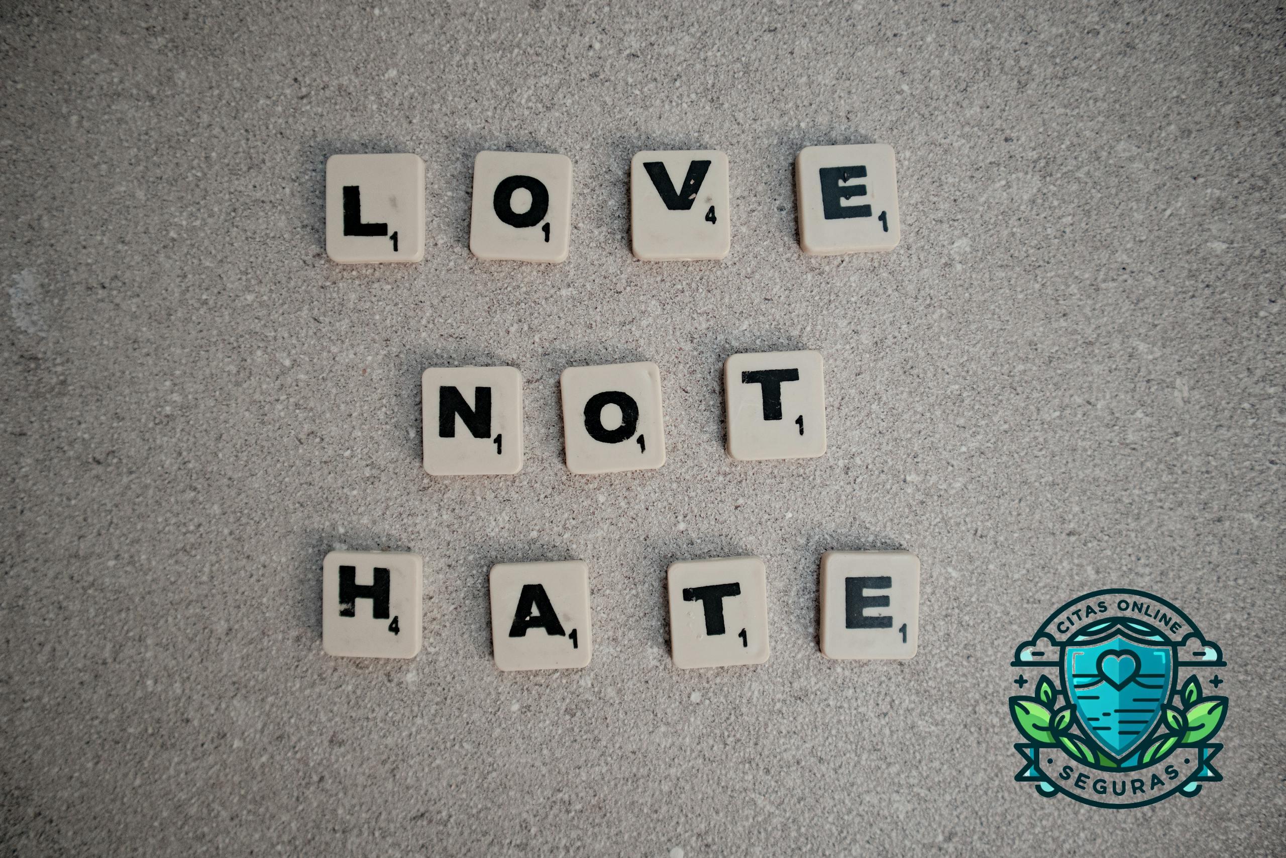 Scrabble tiles on pavement spelling the inspirational message 'Love Not Hate'.
